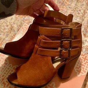 Brand new leather never worn women’s strapped boots with heel.